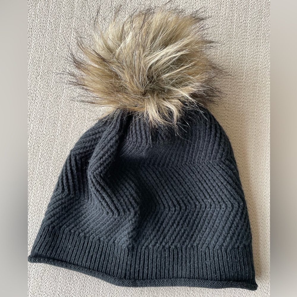 TNA black knitted hat with a cute pom pom
